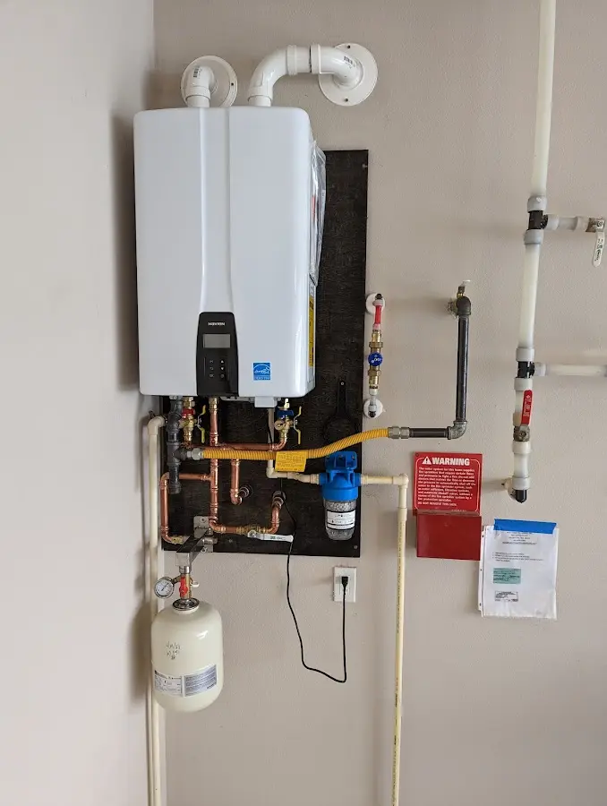 Professional plumber installing copper piping in a Delta home